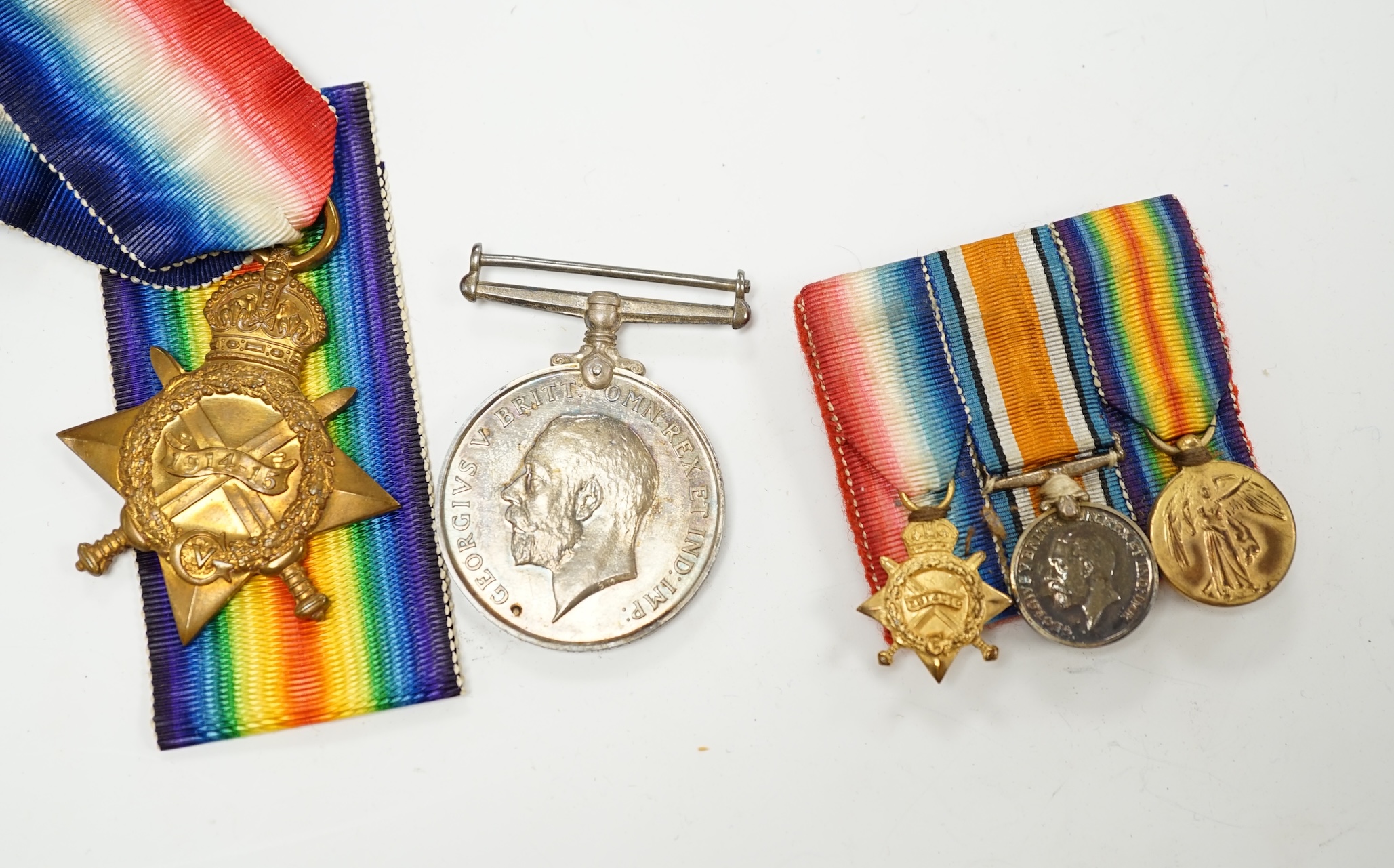 A First World War medal trio awarded to Pte. R.N. Randell, Canadian Forces, together with the miniature set, original card box of issue, the original envelope, paperwork and War Office issued folder. Condition - fair to